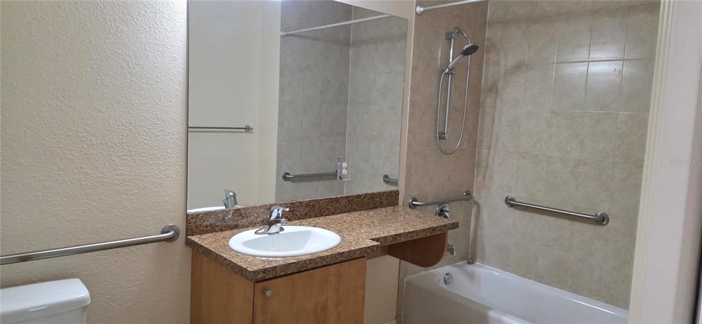 26172 Explorer Road, Unit 4 Punta Gorda, FL 33983 - Photo 10 of 11 a bathroom with a sink and a mirror