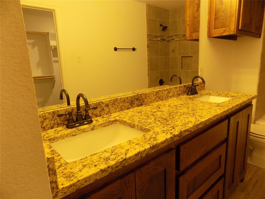 506 Pecan Tree Court Poolville, TX 76487 - Photo 23 of 36 Notice the large sinks and extraordinary granite counter tops