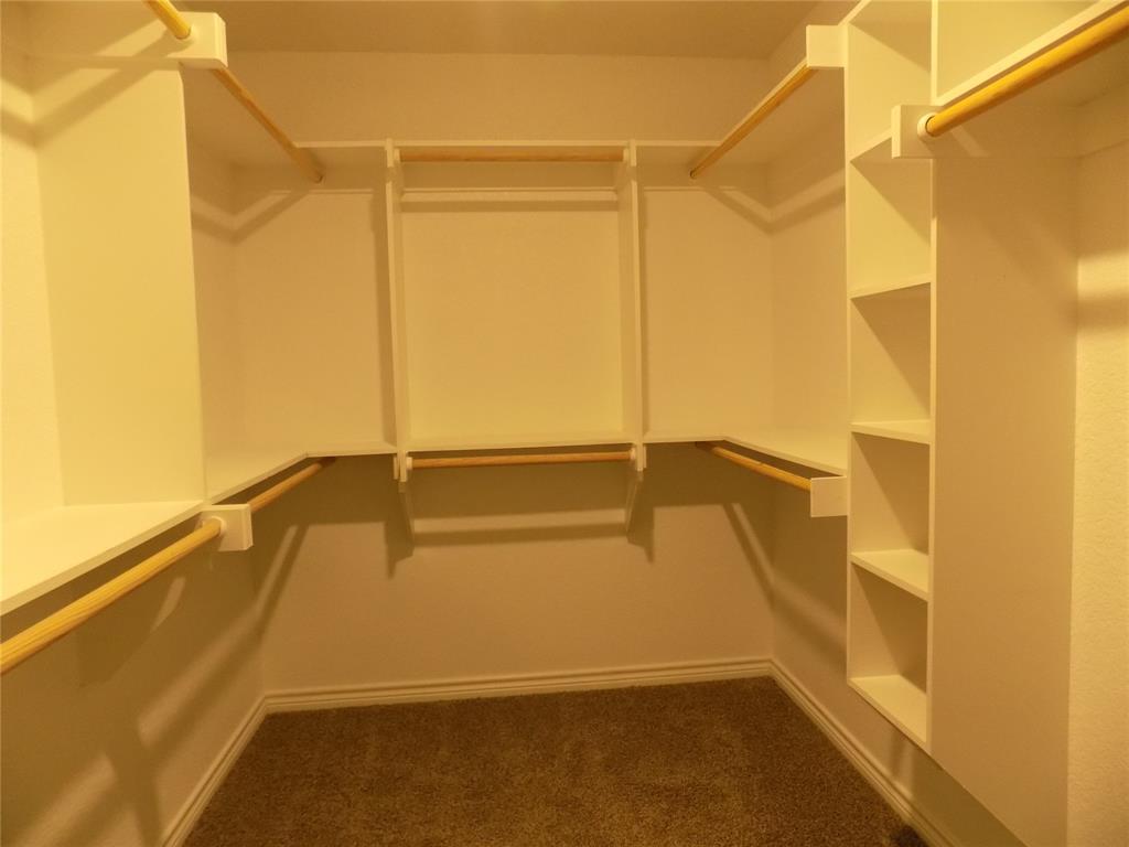 506 Pecan Tree Court Poolville, TX 76487 - Photo 26 of 36 Another view of primary bedroom's walk-in closet