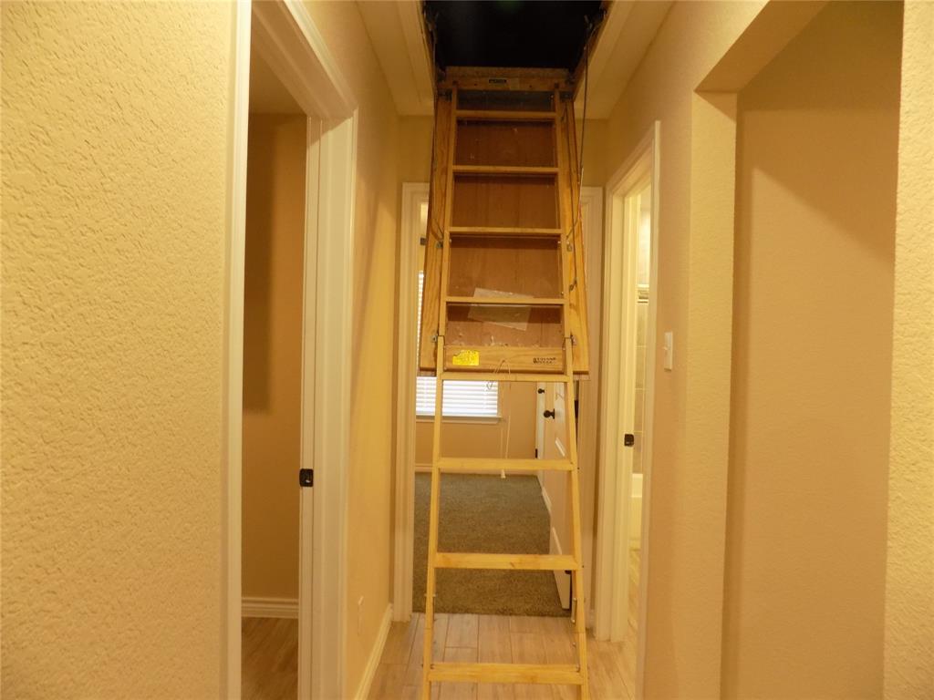 506 Pecan Tree Court Poolville, TX 76487 - Photo 27 of 36 Ladder access to attic