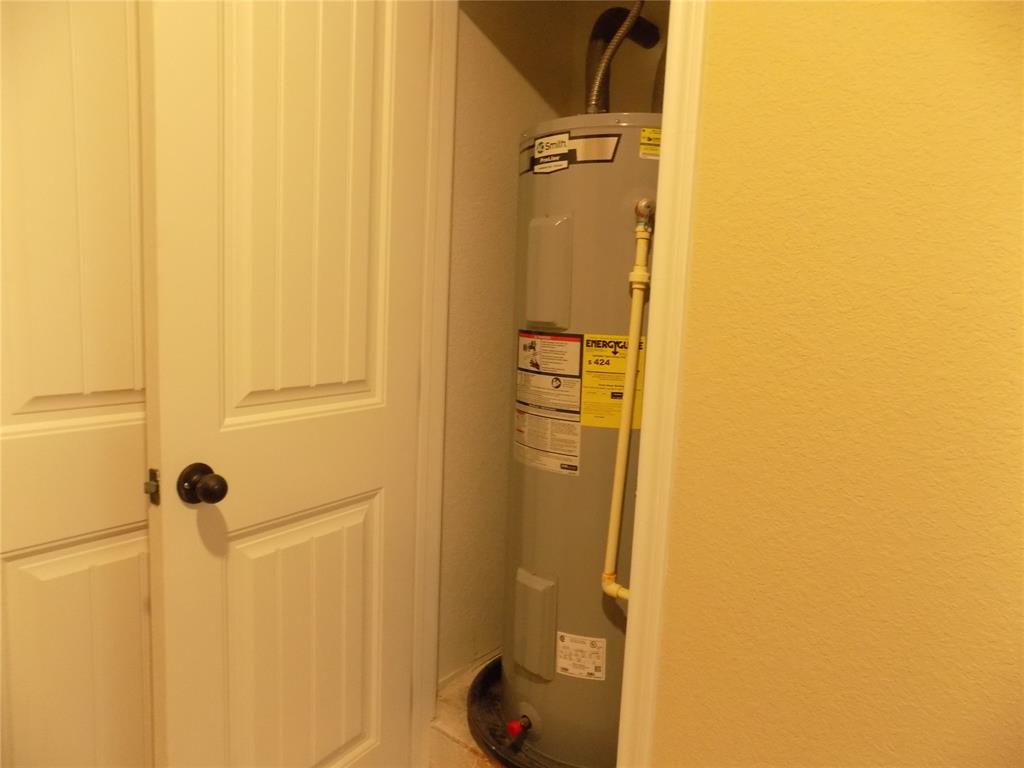 506 Pecan Tree Court Poolville, TX 76487 - Photo 31 of 36 Water heater is on the first level of home, not in attic