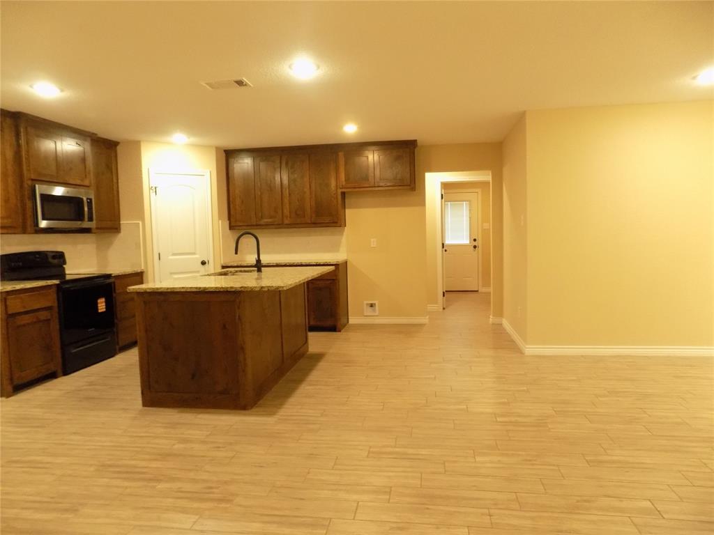 506 Pecan Tree Court Poolville, TX 76487 - Photo 10 of 36 View of kitchen area, very open, lovely