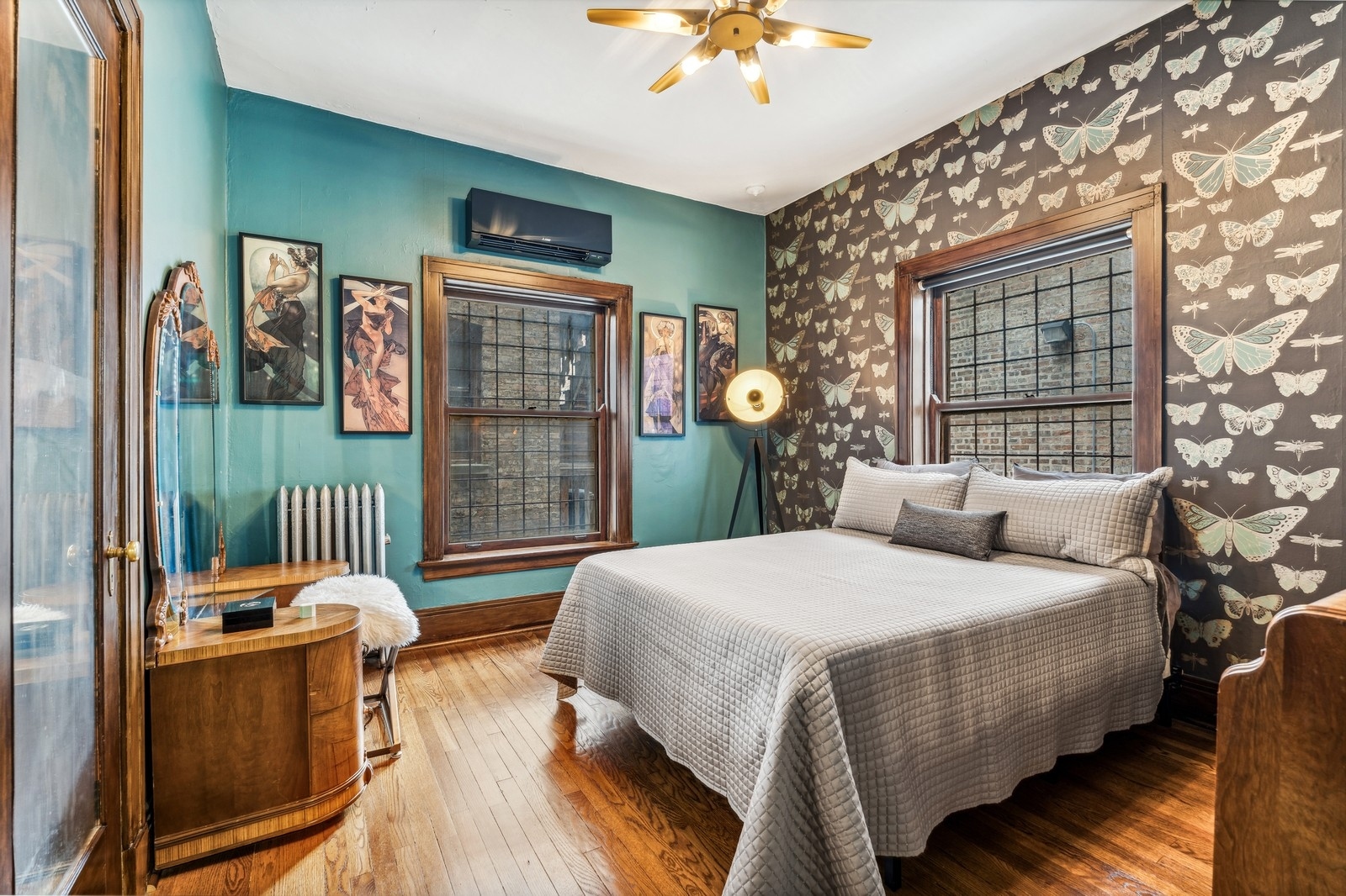851 East Drexel Square, Unit 1A Chicago, IL 60615 - Photo 14 of 21 a bedroom with a bed and a chandelier