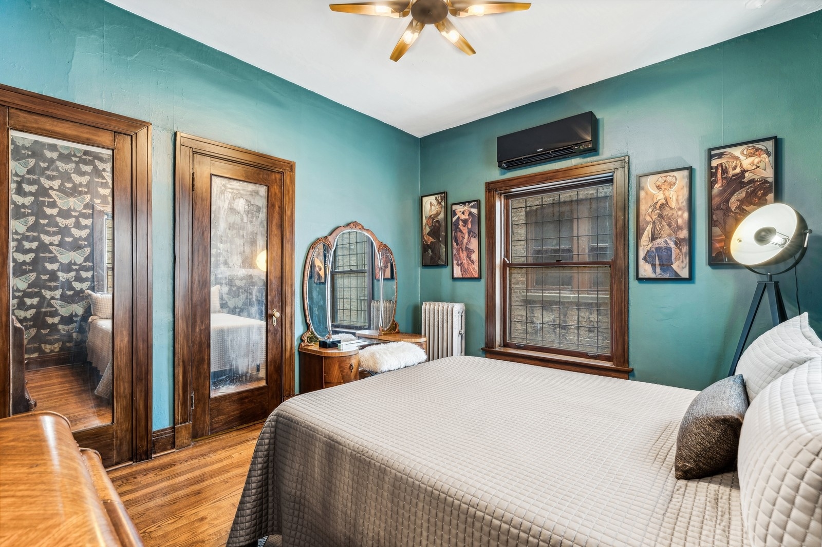 851 East Drexel Square, Unit 1A Chicago, IL 60615 - Photo 15 of 21 a bedroom with a bed and a chandelier