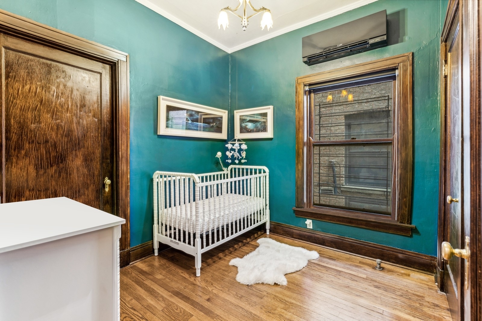 851 East Drexel Square, Unit 1A Chicago, IL 60615 - Photo 17 of 21 a bedroom with a bed and a window