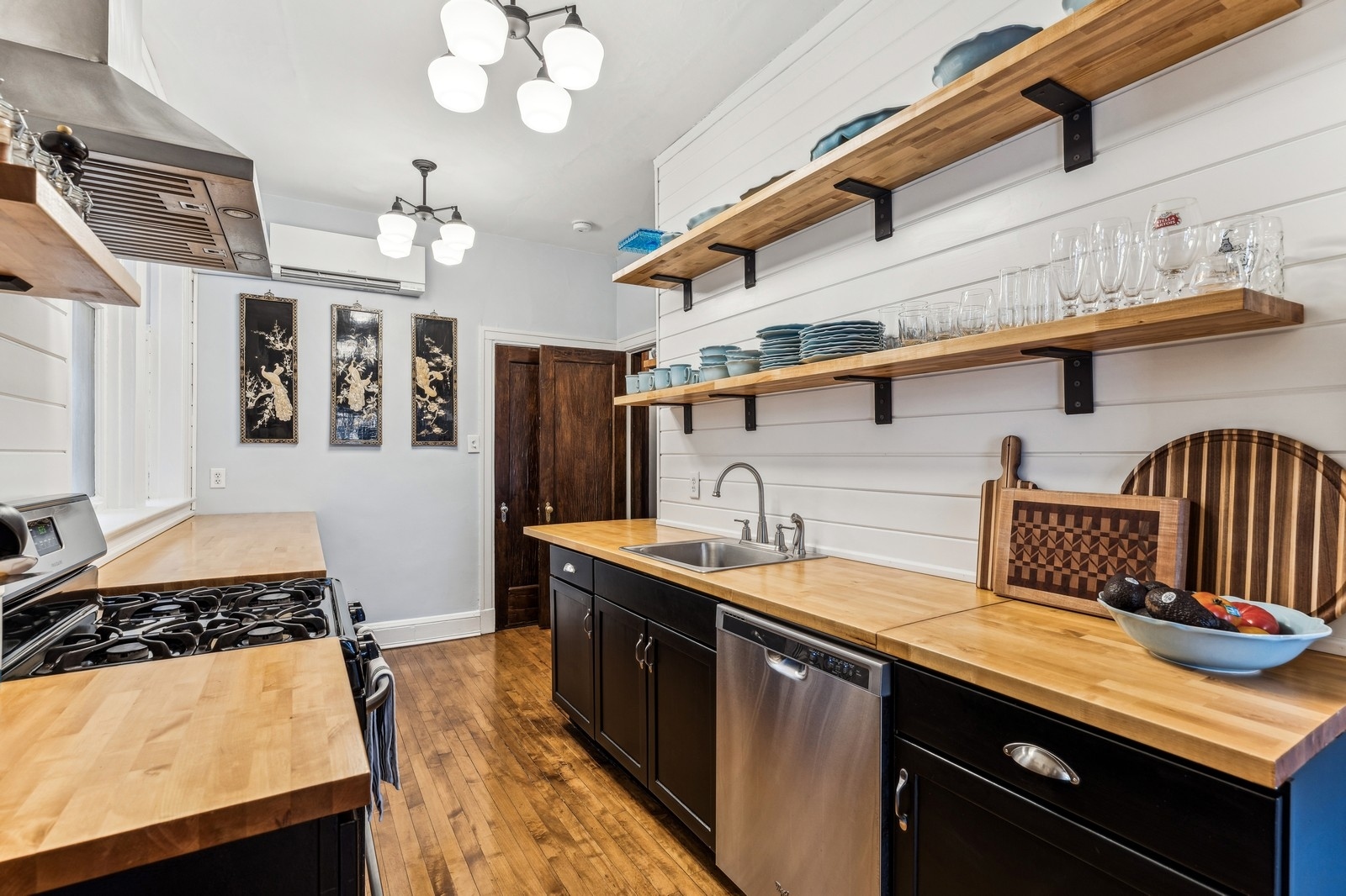 851 East Drexel Square, Unit 1A Chicago, IL 60615 - Photo 6 of 21 a kitchen with stainless steel appliances granite countertop a sink and cabinets