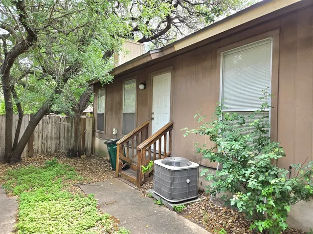 a table and chair in front of a house