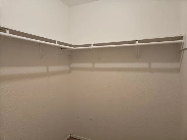 a balcony with trees in front of it