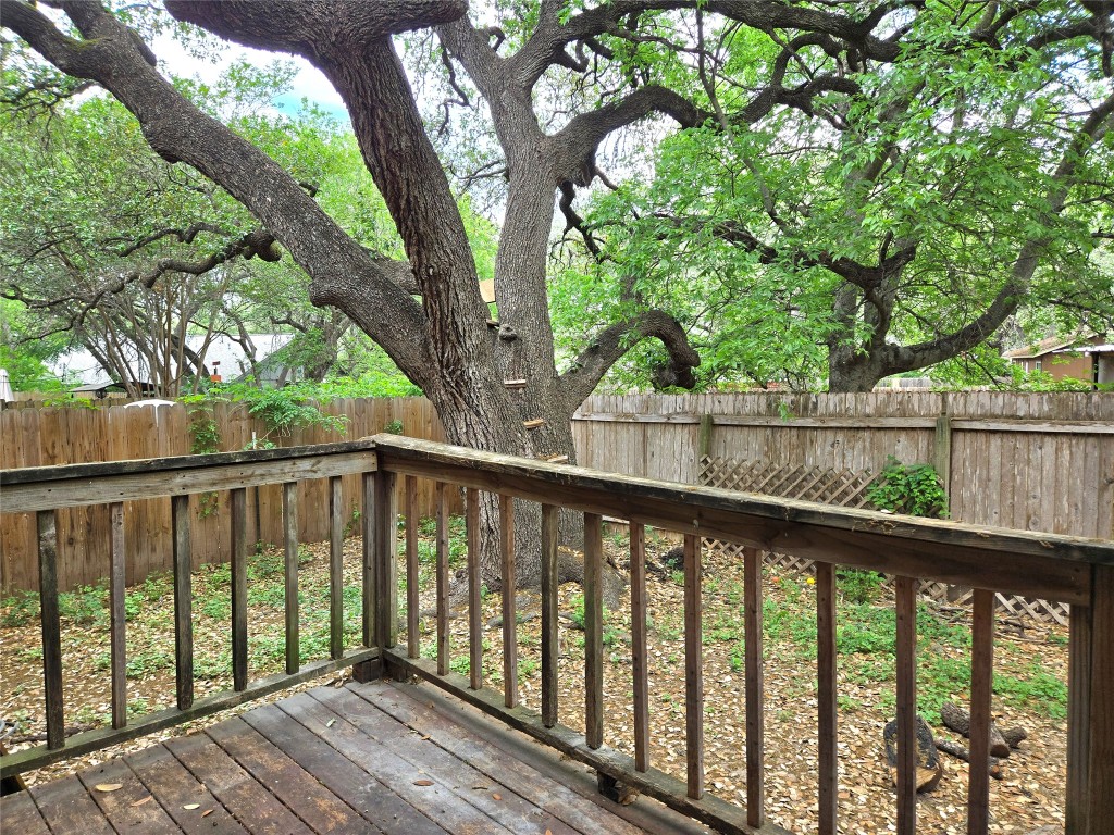 1404 Matthews Lane, Unit A Austin, TX 78745 - Photo 13 of 13 a balcony with trees in front of it