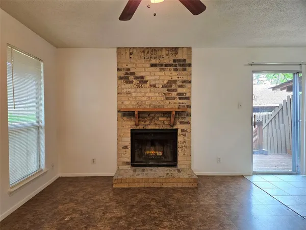 a kitchen with a stove top oven and cabinets