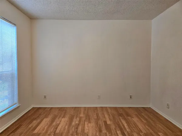 a bathroom with a shower and a bath tub