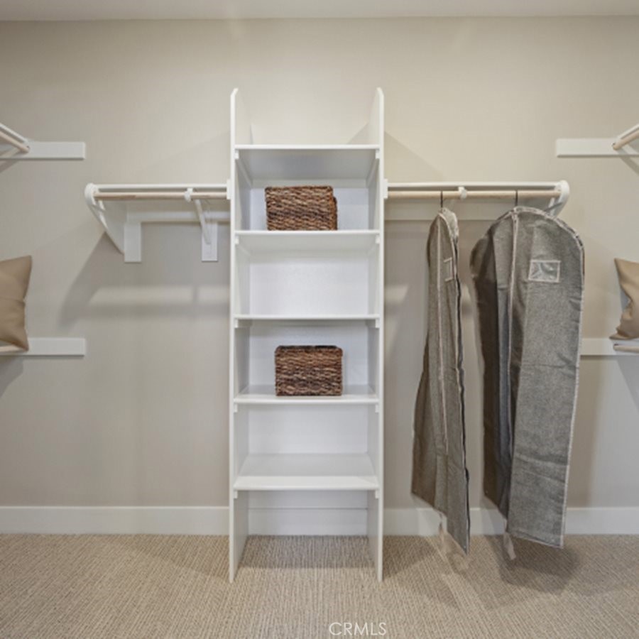 105 Proctor Irvine, CA 92618 - Photo 15 of 33 a view of walk in closet with clothes and shoes