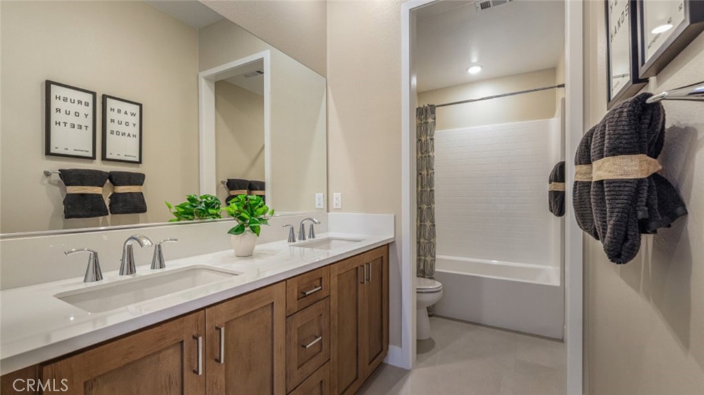 105 Proctor Irvine, CA 92618 - Photo 19 of 33 a bathroom with a granite countertop sink a toilet and shower