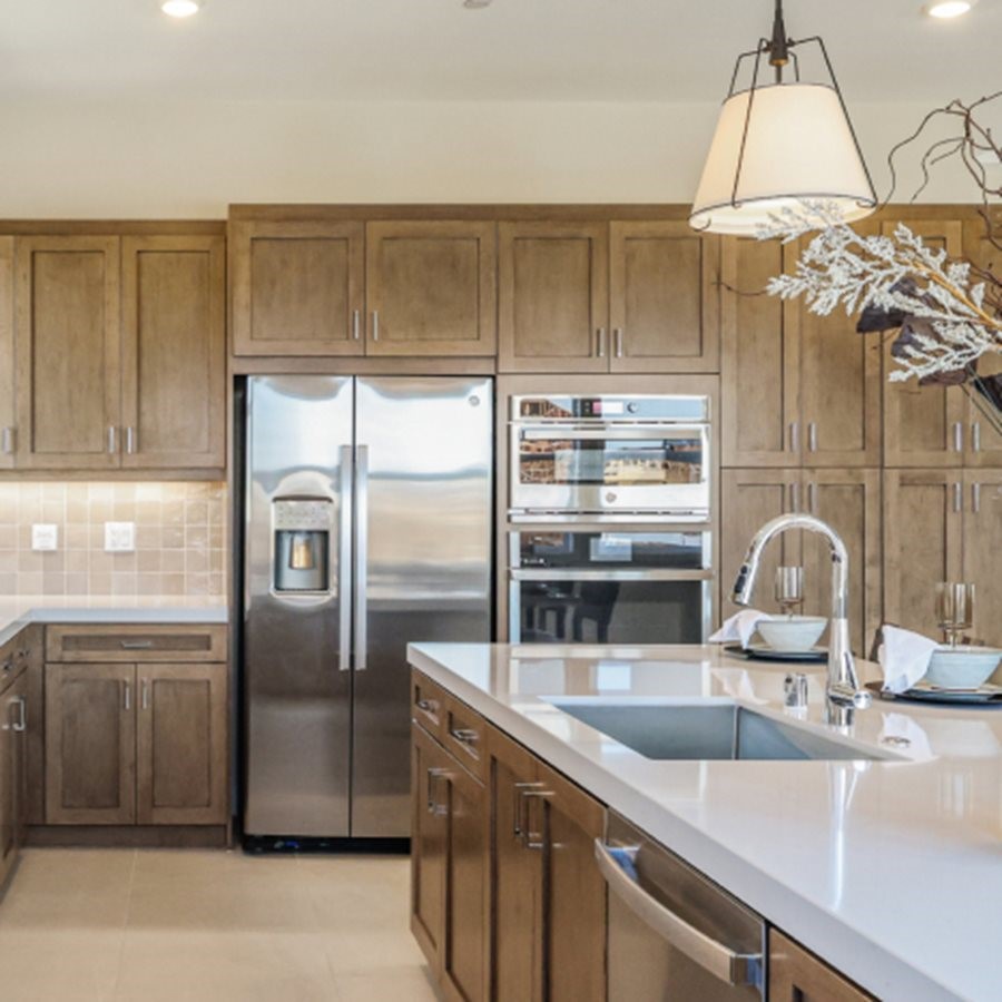 105 Proctor Irvine, CA 92618 - Photo 4 of 33 a kitchen with kitchen island a counter top space cabinets and stainless steel appliances