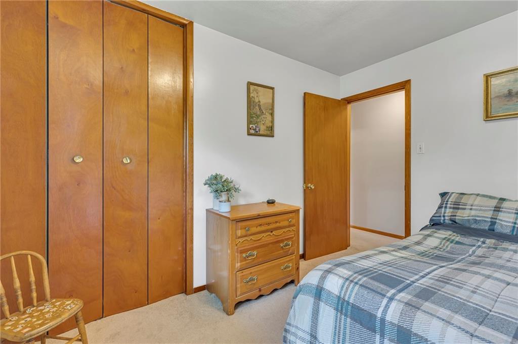 383 Ridgemont Drive Midland, PA 15059 - Photo 40 of 44 a bedroom with a bed and furniture