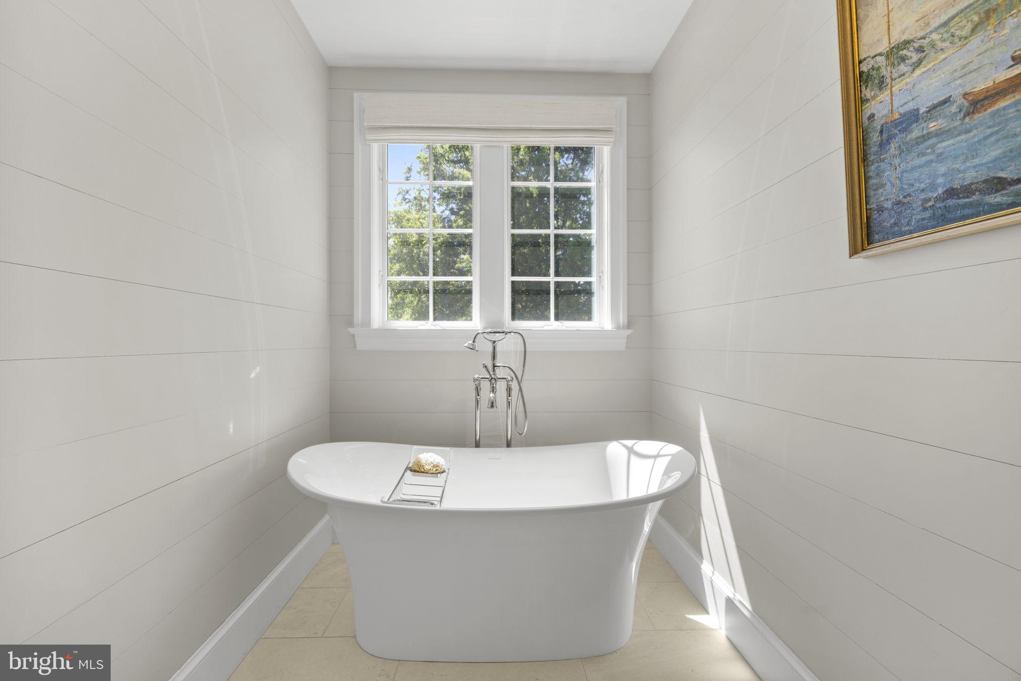 36190 Turkey Roost Road Middleburg, VA 20117 - Photo 44 of 88 a white bath tub sitting in a bathroom