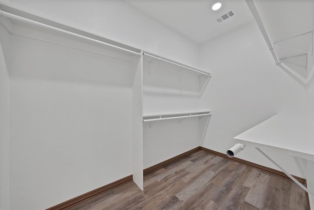 206 Hix Road Cleburne, TX 76031 - Photo 16 of 40 Walk in closet featuring light wood finished floors