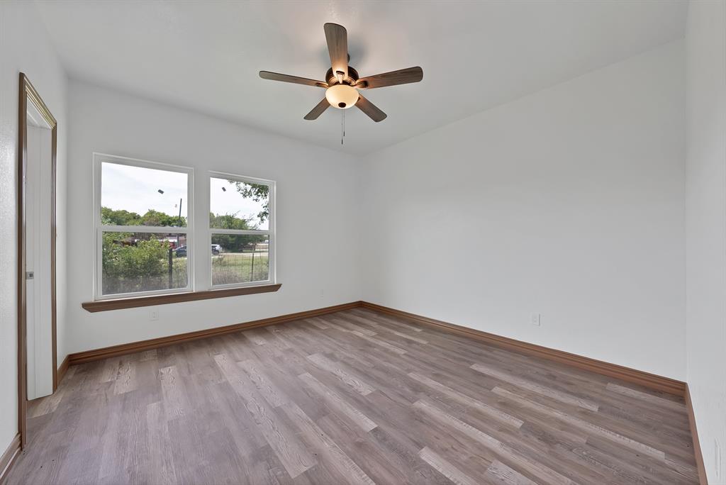 206 Hix Road Cleburne, TX 76031 - Photo 17 of 40 Empty room with light wood-style flooring and a ceiling fan