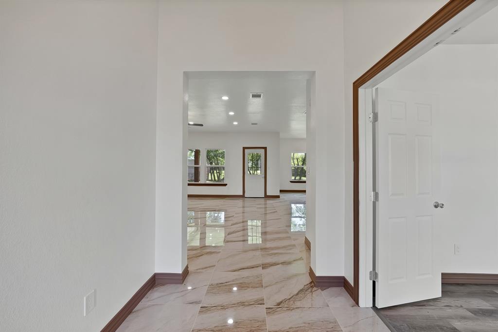 206 Hix Road Cleburne, TX 76031 - Photo 22 of 40 Foyer entrance with light marble finish floors and recessed lighting