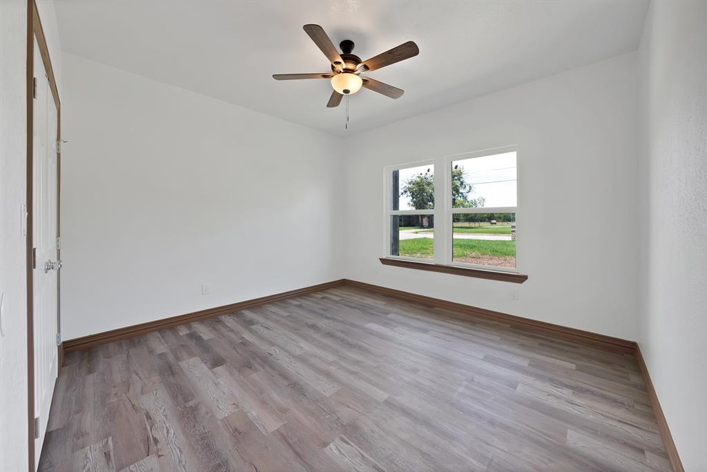206 Hix Road Cleburne, TX 76031 - Photo 25 of 40 Spare room featuring light wood-type flooring and a ceiling fan