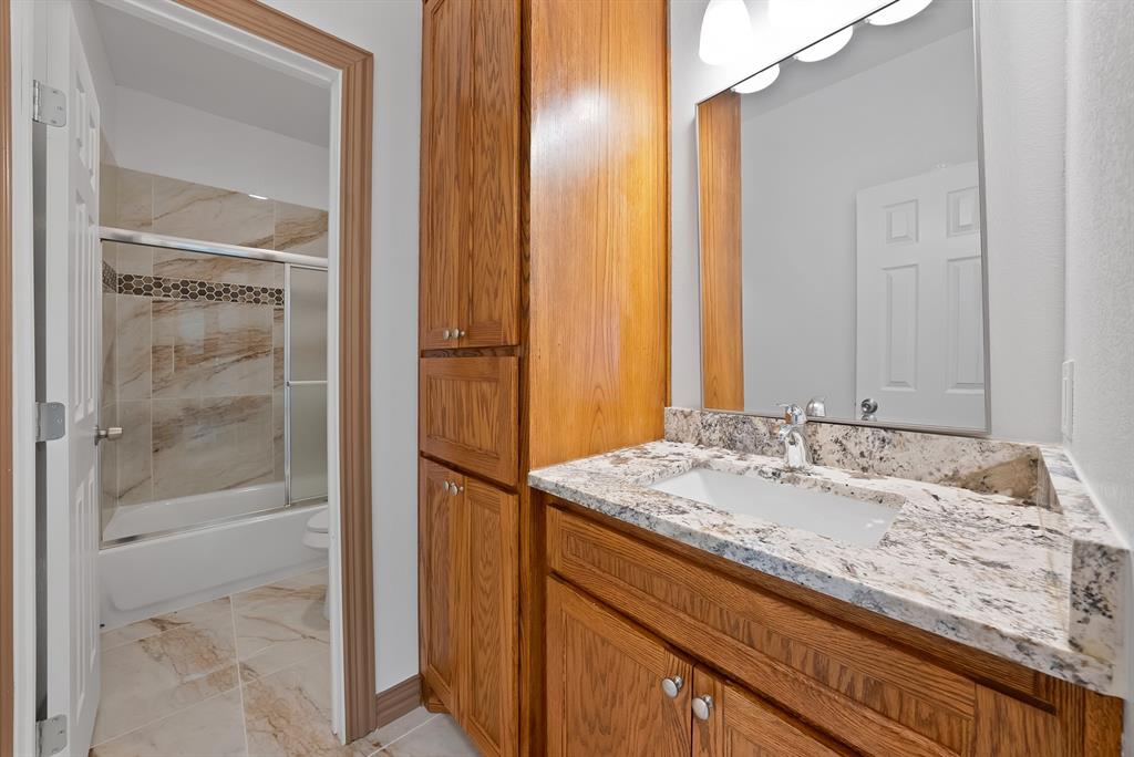 206 Hix Road Cleburne, TX 76031 - Photo 27 of 40 Full bath featuring combined bath / shower with glass door and vanity