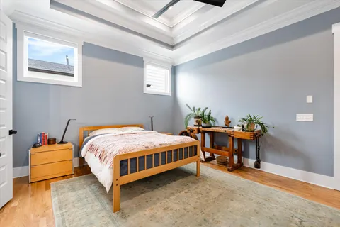 a bedroom with a bed and a table in it