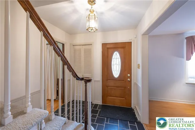 a view of entryway with wooden floor