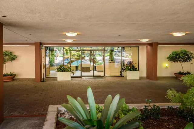 a view of a lobby with furniture and floor to ceiling window