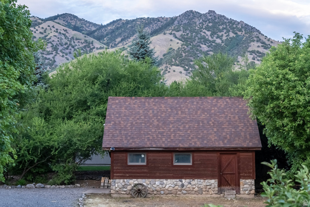 435 Canyon Road Millville, UT 84326 - Photo 48 of 113 Wood-sided outbuilding with a stone foundation and shingle roof