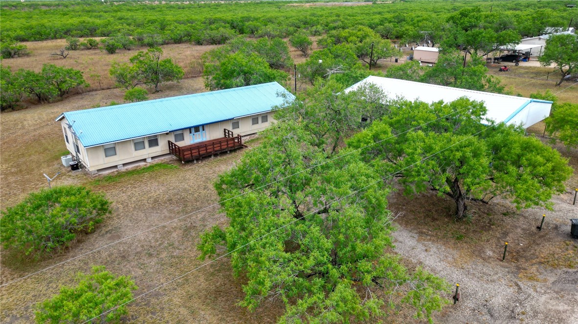 an aerial view of a house having yard