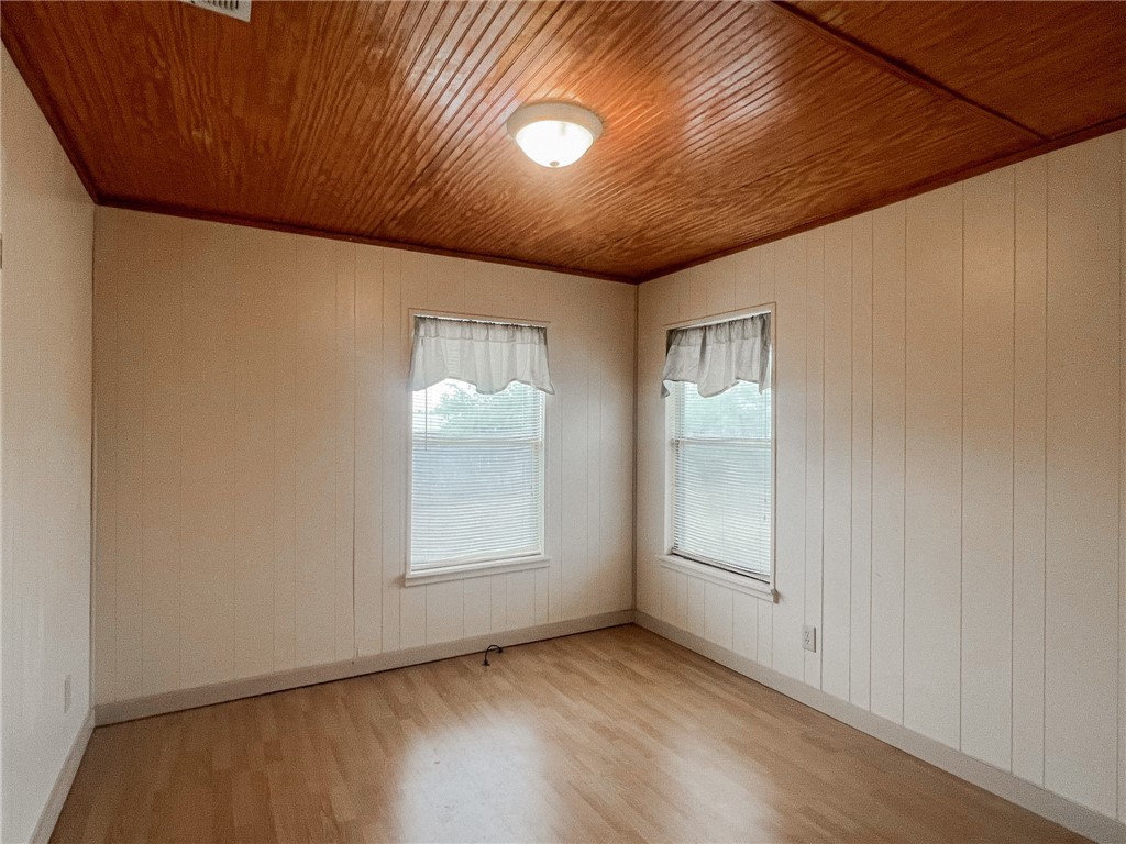 156 Naylor Road Calliham, TX 78007 - Photo 11 of 28 a view of an empty room with a window and wooden floor