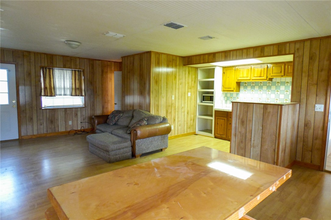 156 Naylor Road Calliham, TX 78007 - Photo 17 of 28 a living room with a bed furniture and next to a window
