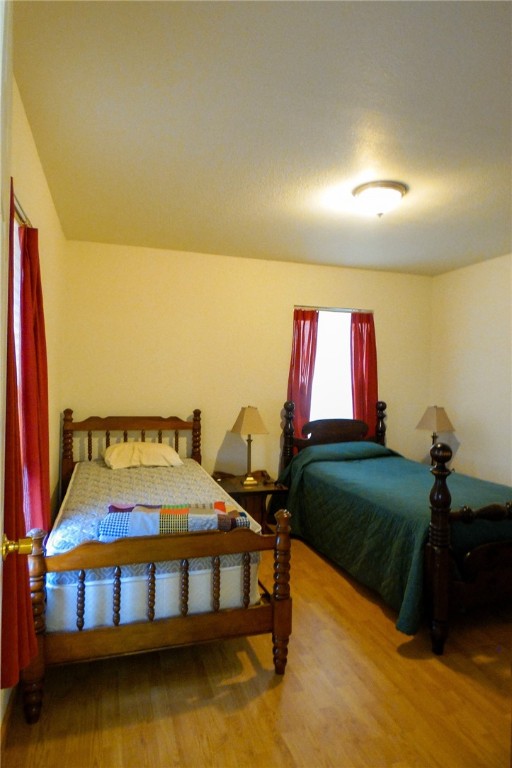 156 Naylor Road Calliham, TX 78007 - Photo 22 of 28 a bedroom with a bed and a window