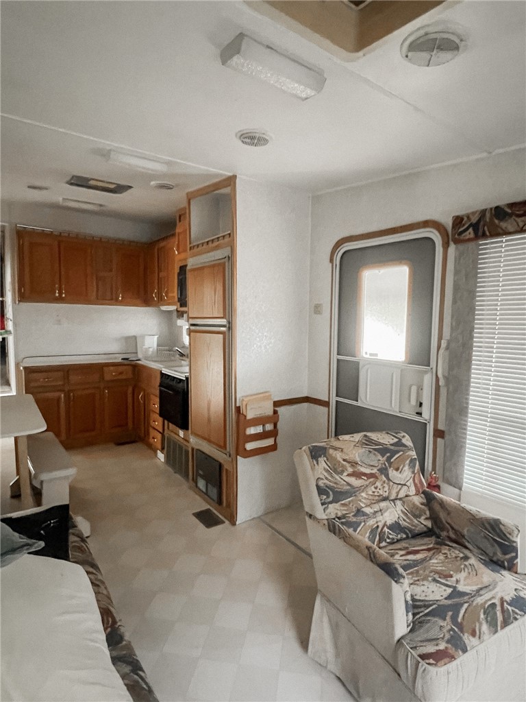 156 Naylor Road Calliham, TX 78007 - Photo 28 of 28 a kitchen with a refrigerator and a sink