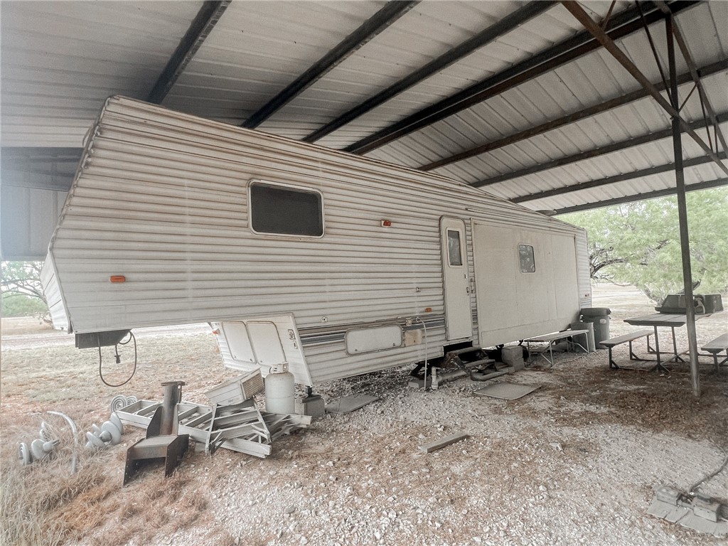 156 Naylor Road Calliham, TX 78007 - Photo 4 of 28 a view of a backyard with chairs and a large tree