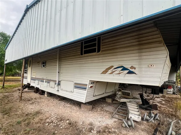 an outdoor view of house with balcony