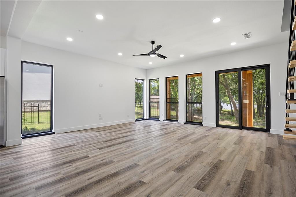 2811 Rodeo Drive Quinlan, TX 75474 - Photo 8 of 35 Unfurnished room featuring recessed lighting, light wood-style flooring, and a ceiling fan