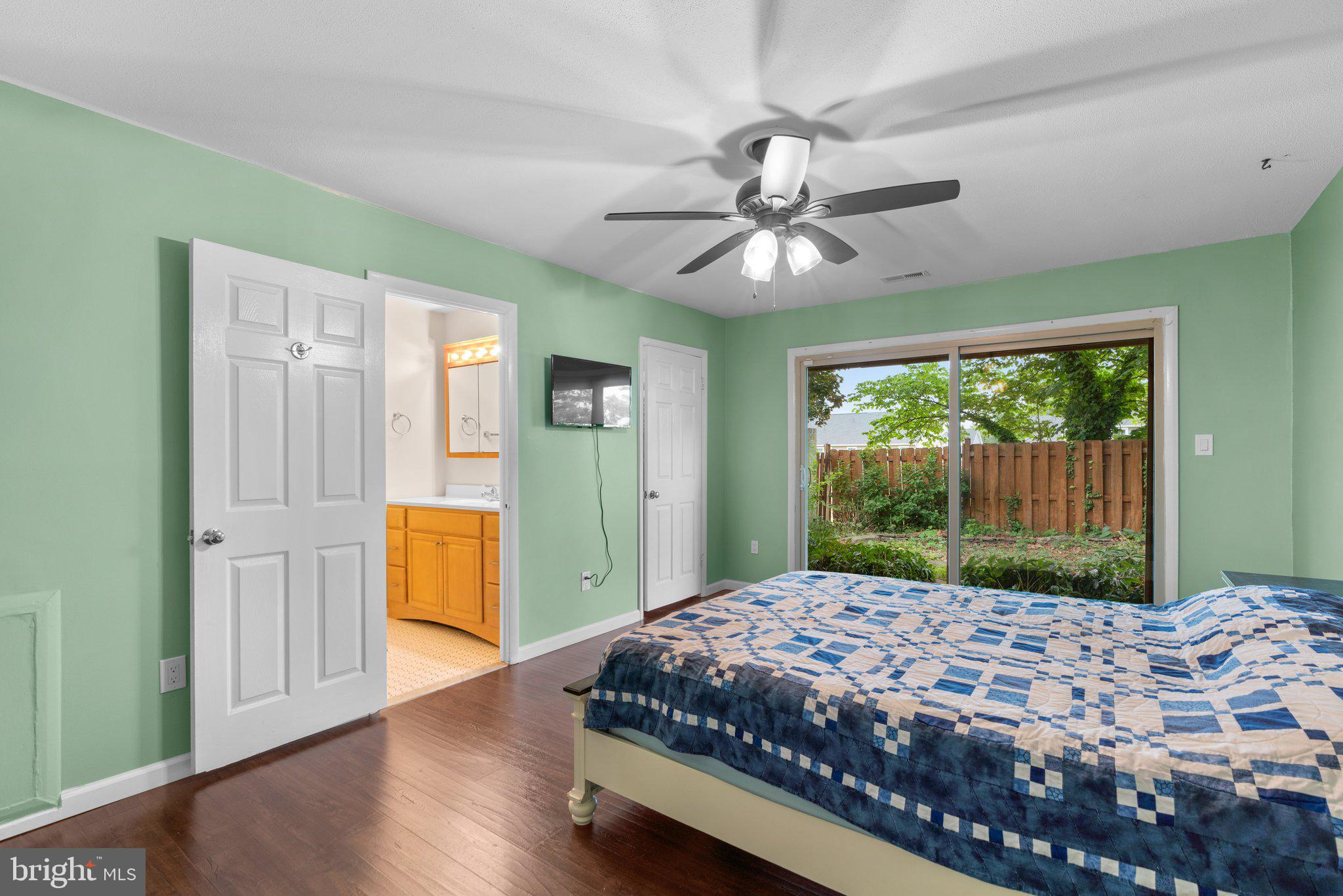 5367 Flight Feather Columbia, MD 21045 - Photo 19 of 42 a bedroom with a large bed and a chandelier