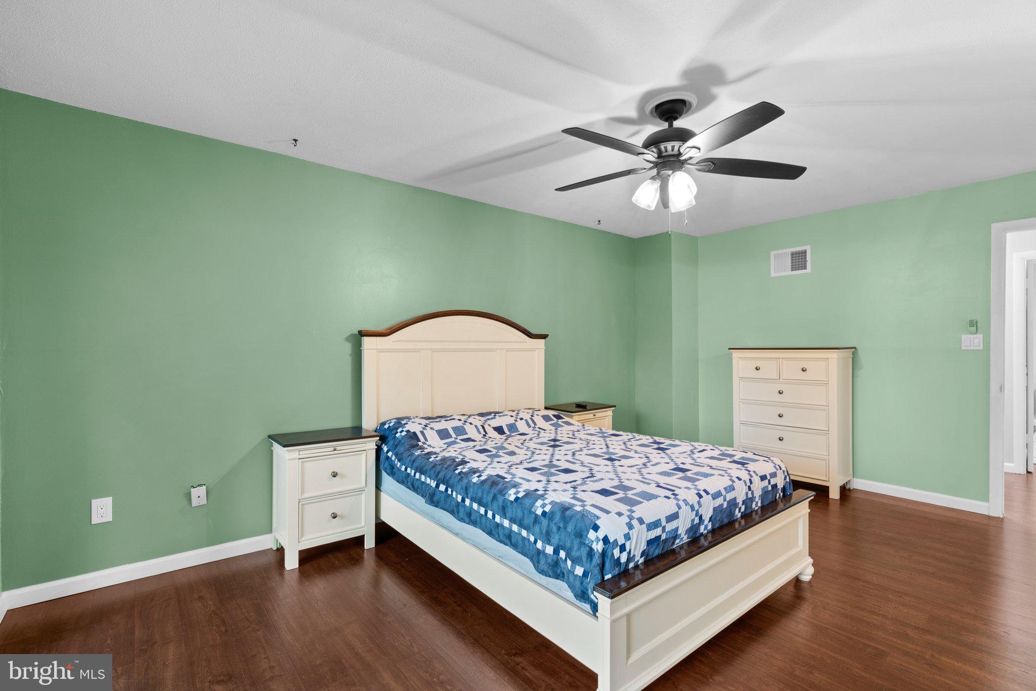 5367 Flight Feather Columbia, MD 21045 - Photo 21 of 42 a bedroom with a bed and a chandelier