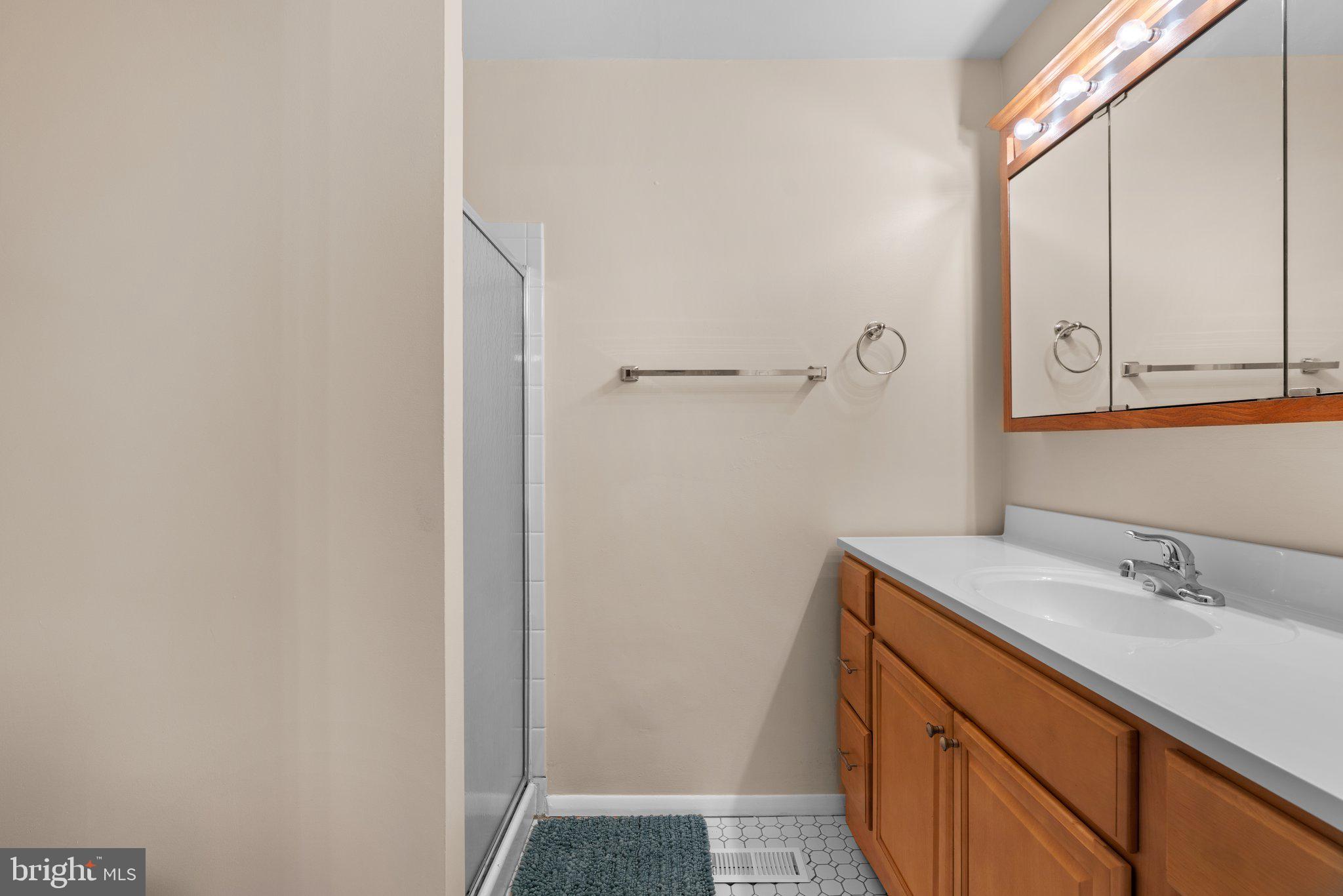 5367 Flight Feather Columbia, MD 21045 - Photo 23 of 42 a bathroom with a sink and a mirror