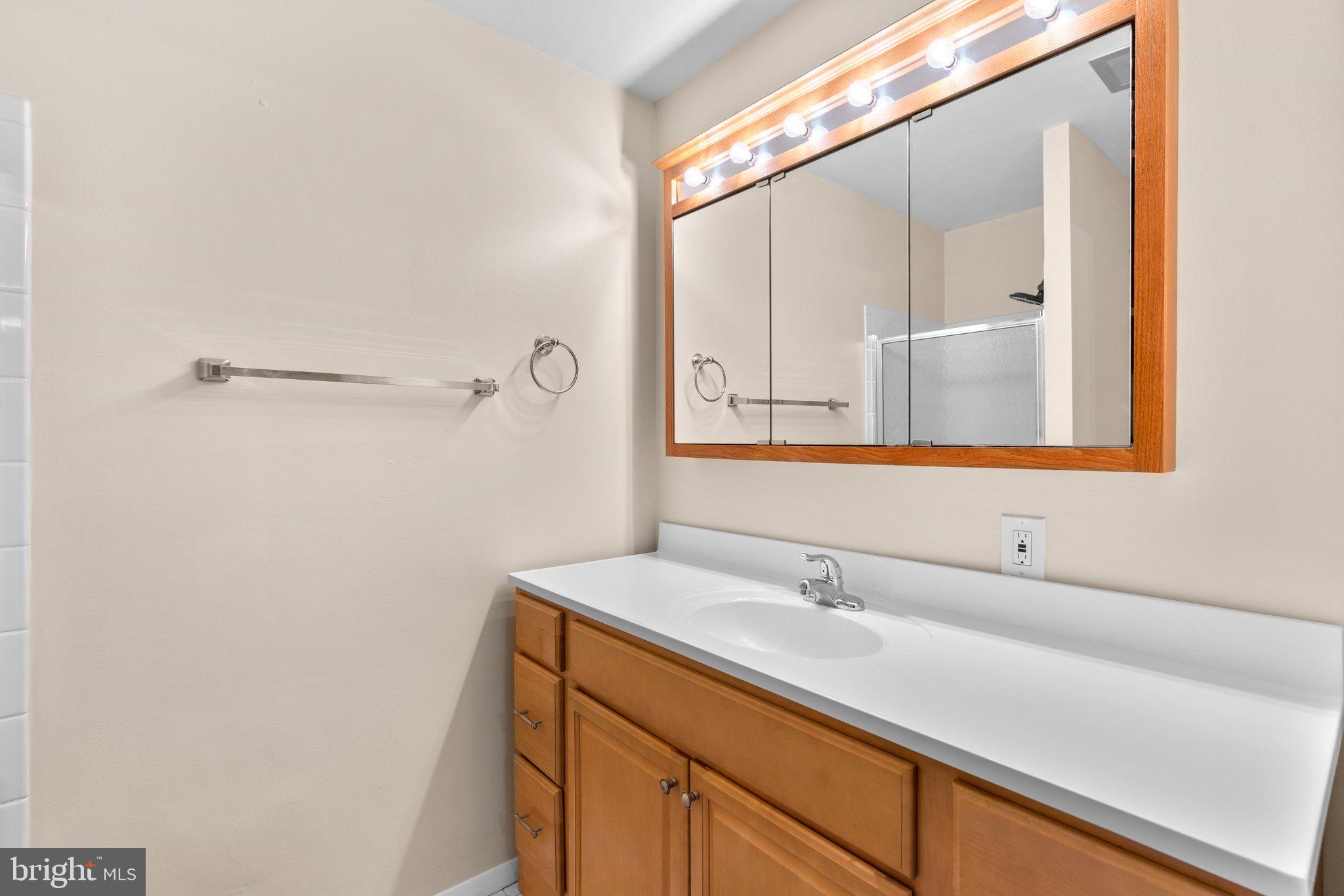 5367 Flight Feather Columbia, MD 21045 - Photo 24 of 42 a bathroom with a sink and a mirror