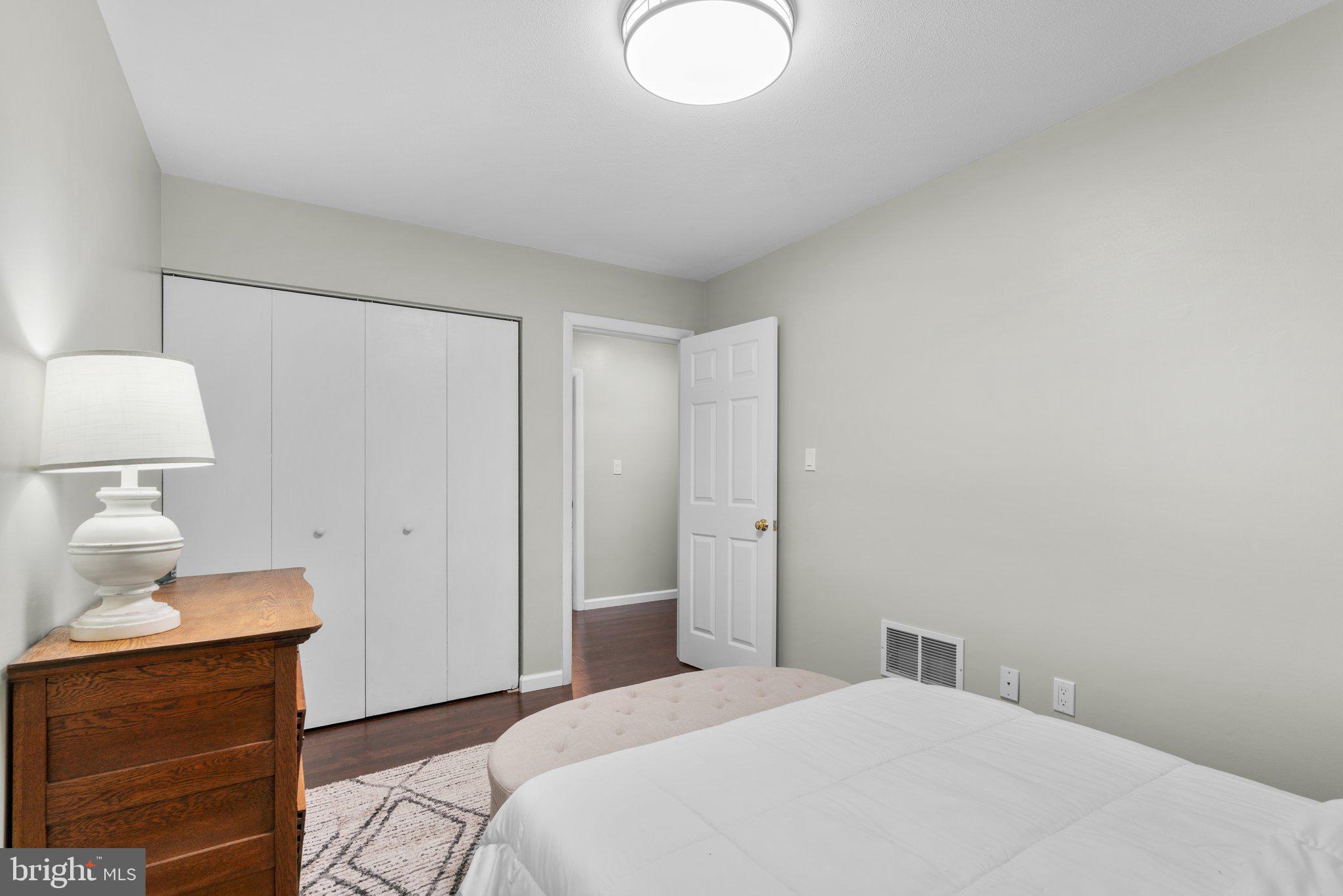 5367 Flight Feather Columbia, MD 21045 - Photo 26 of 42 a bedroom with a bed and a lamp on the dresser