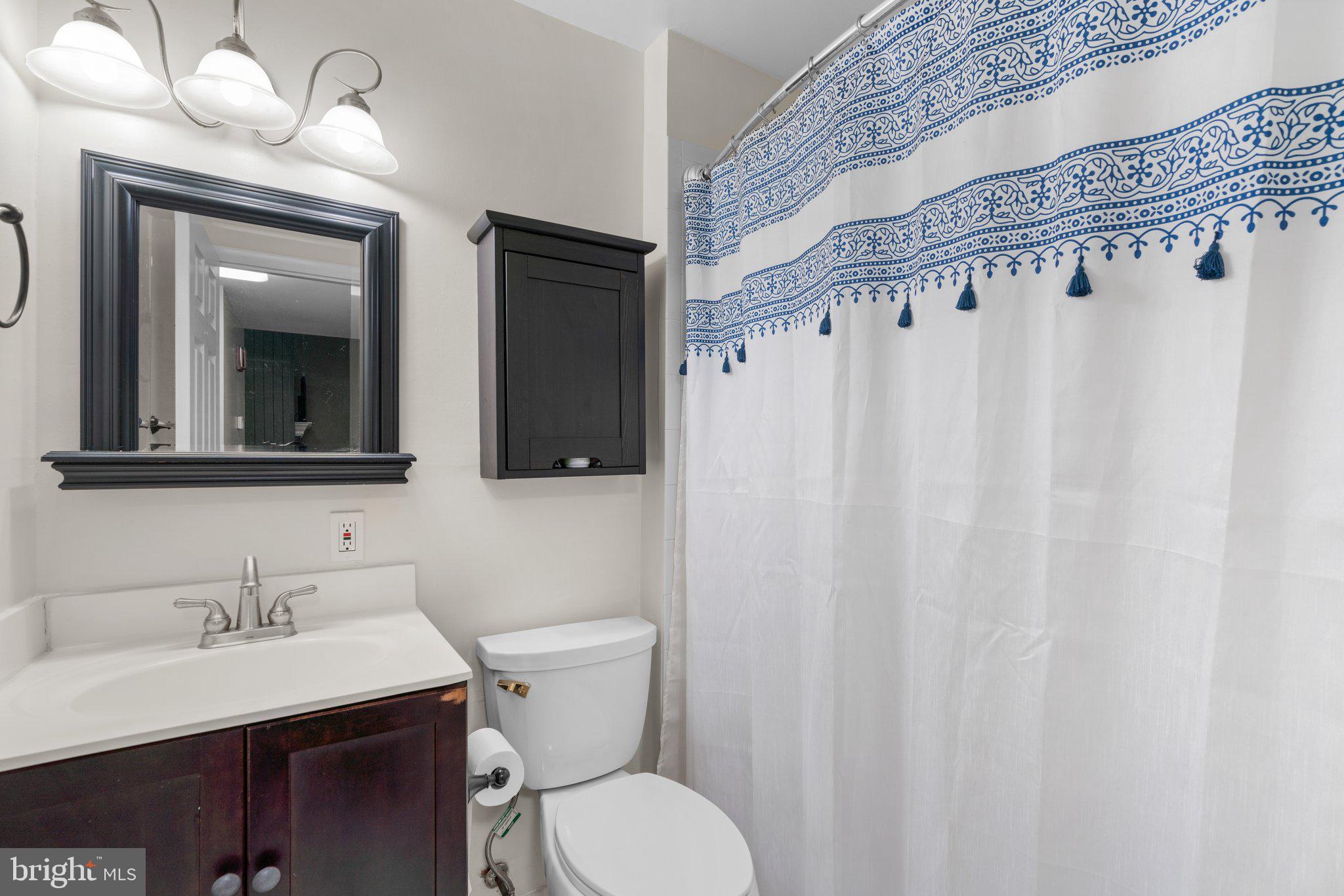 5367 Flight Feather Columbia, MD 21045 - Photo 27 of 42 a bathroom with a toilet a sink and a mirror