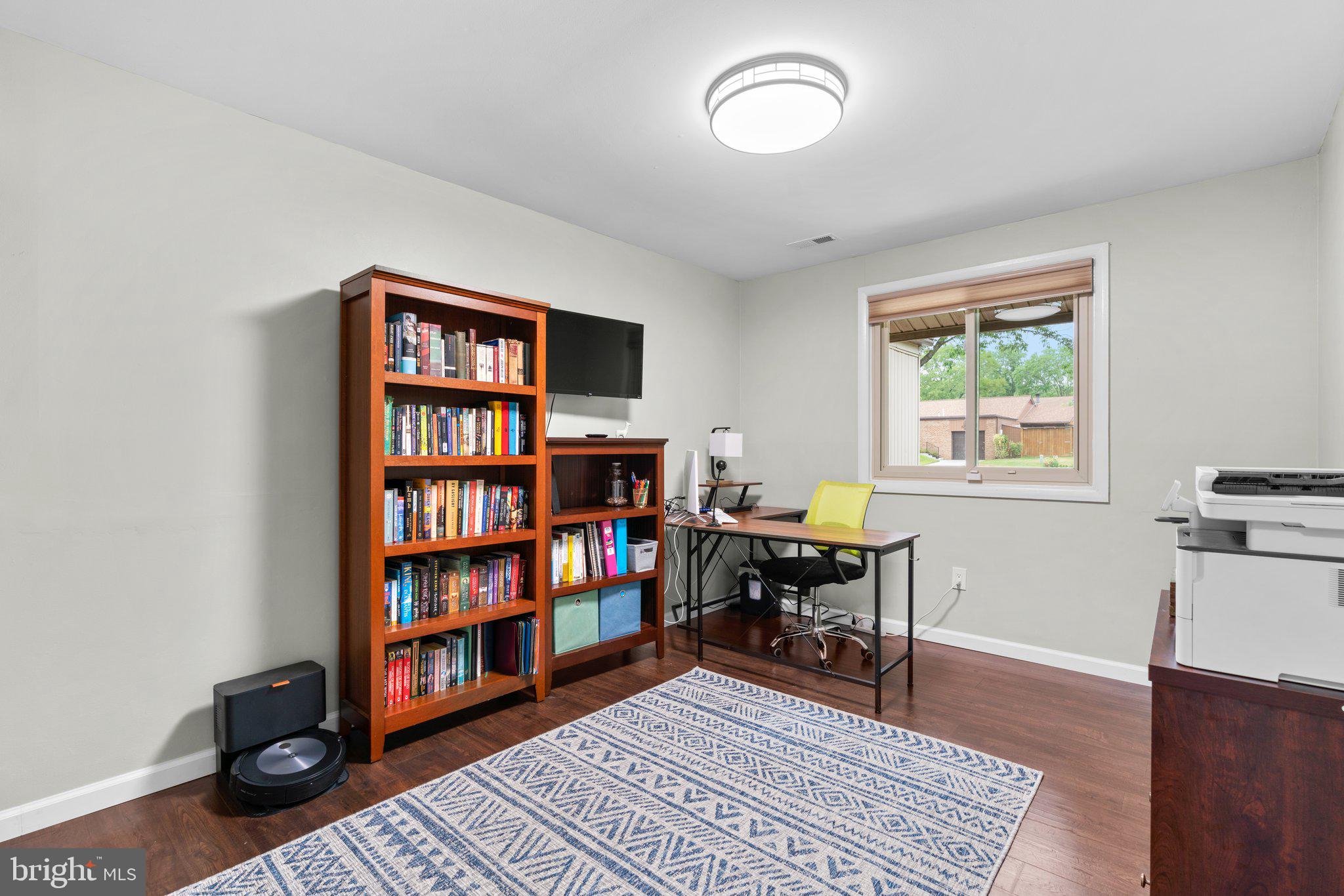 5367 Flight Feather Columbia, MD 21045 - Photo 28 of 42 a view of a workspace with furniture and a bookshelf