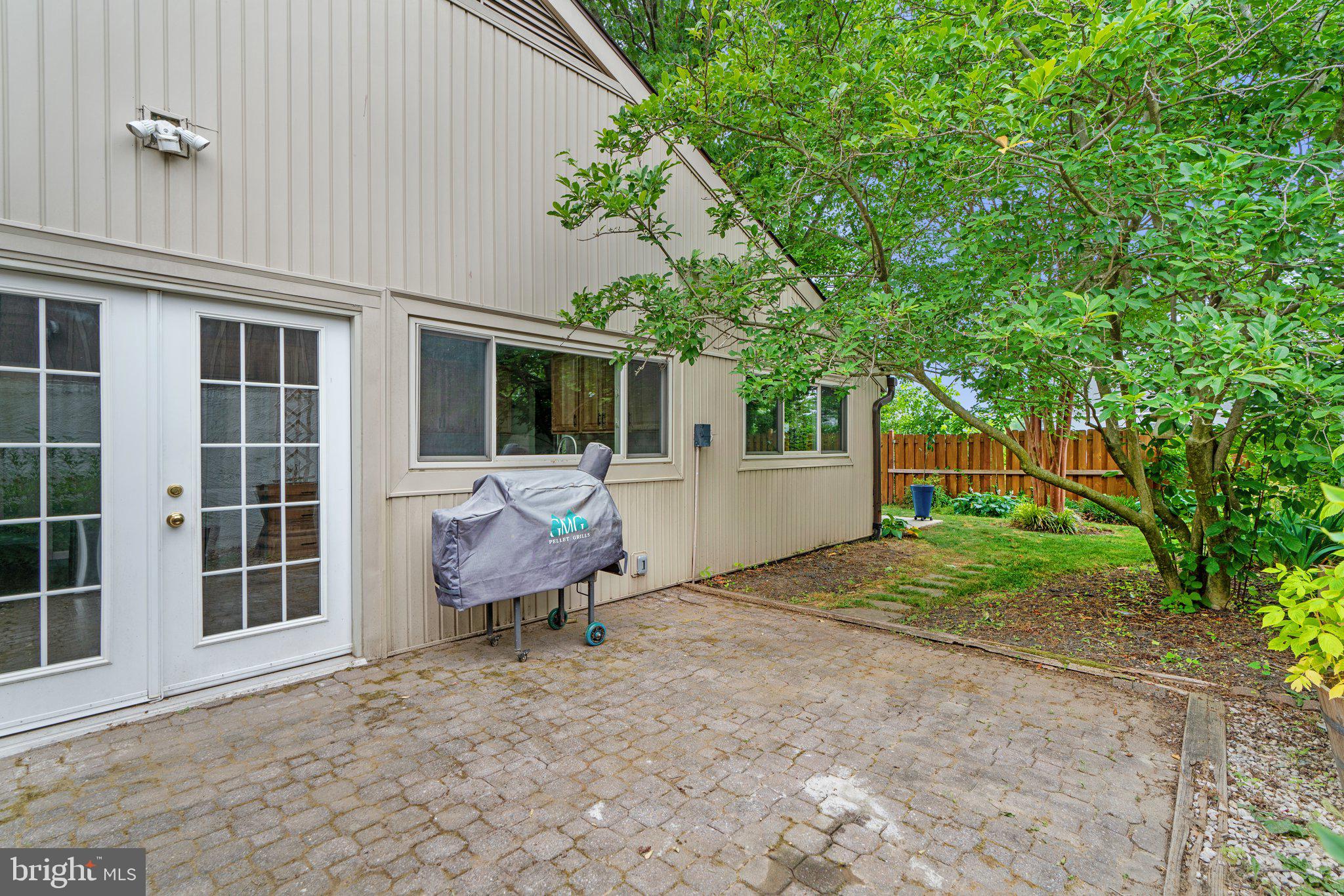5367 Flight Feather Columbia, MD 21045 - Photo 36 of 42 a view of a backyard with table and chairs and wooden fence