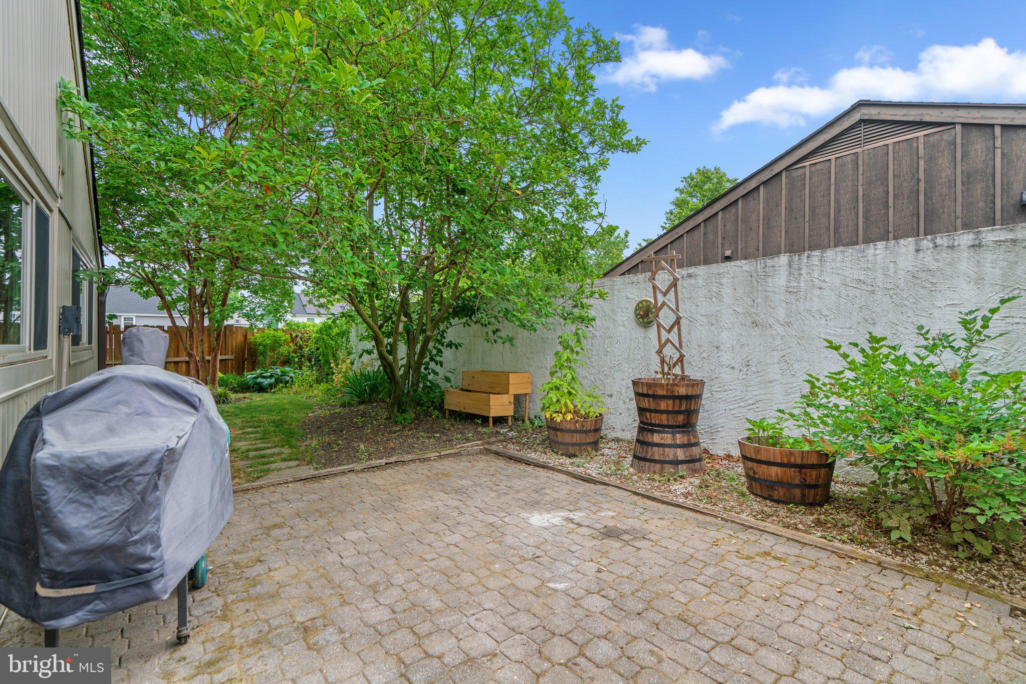 5367 Flight Feather Columbia, MD 21045 - Photo 37 of 42 a view of a backyard with table and chairs and potted plants