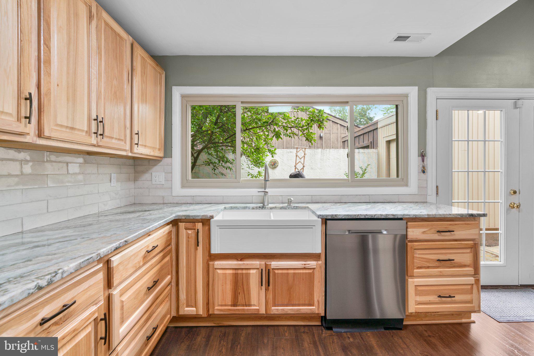 5367 Flight Feather Columbia, MD 21045 - Photo 4 of 42 a kitchen with granite countertop a sink and a window