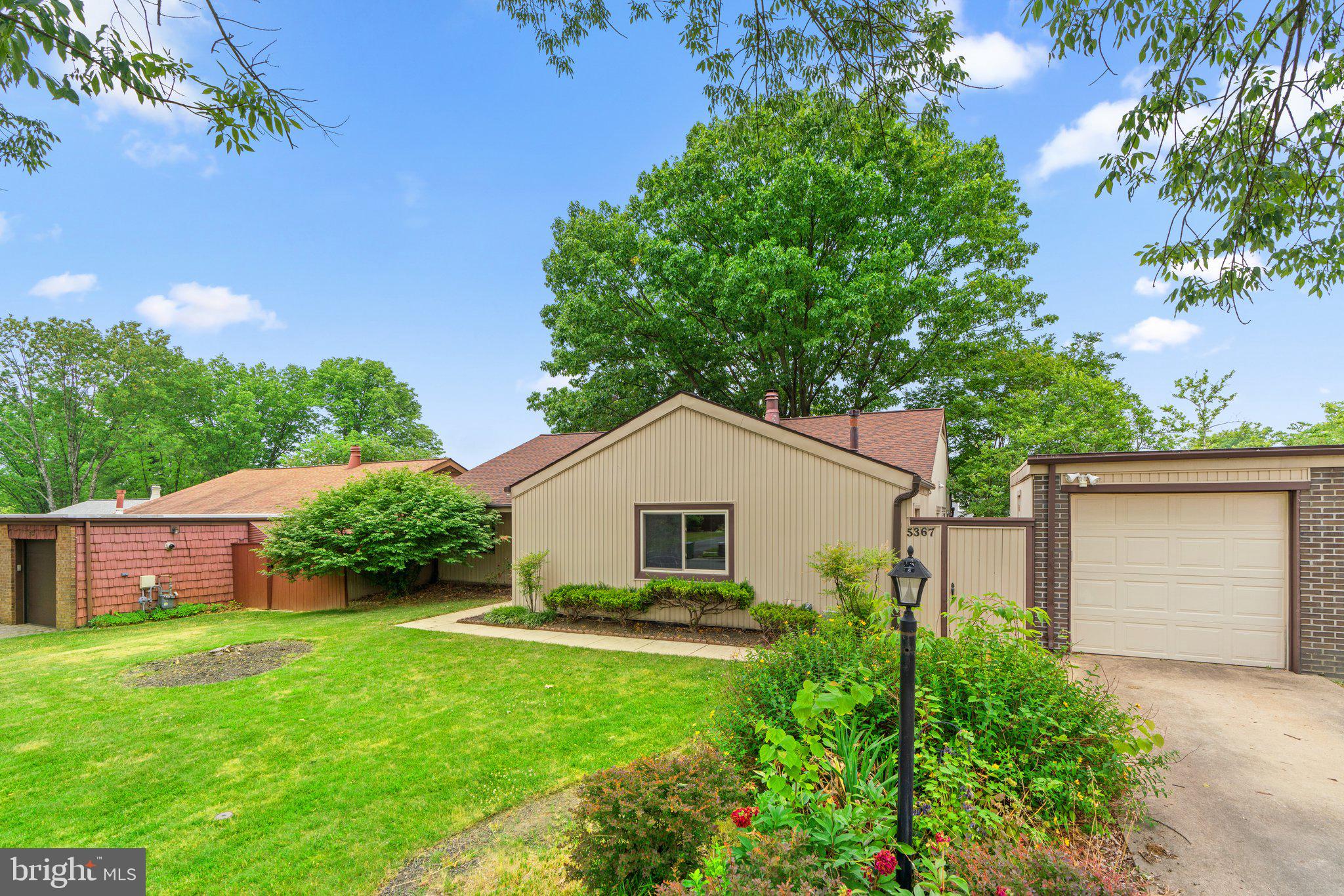 5367 Flight Feather Columbia, MD 21045 - Photo 40 of 42 a view of a house with a yard and a garden