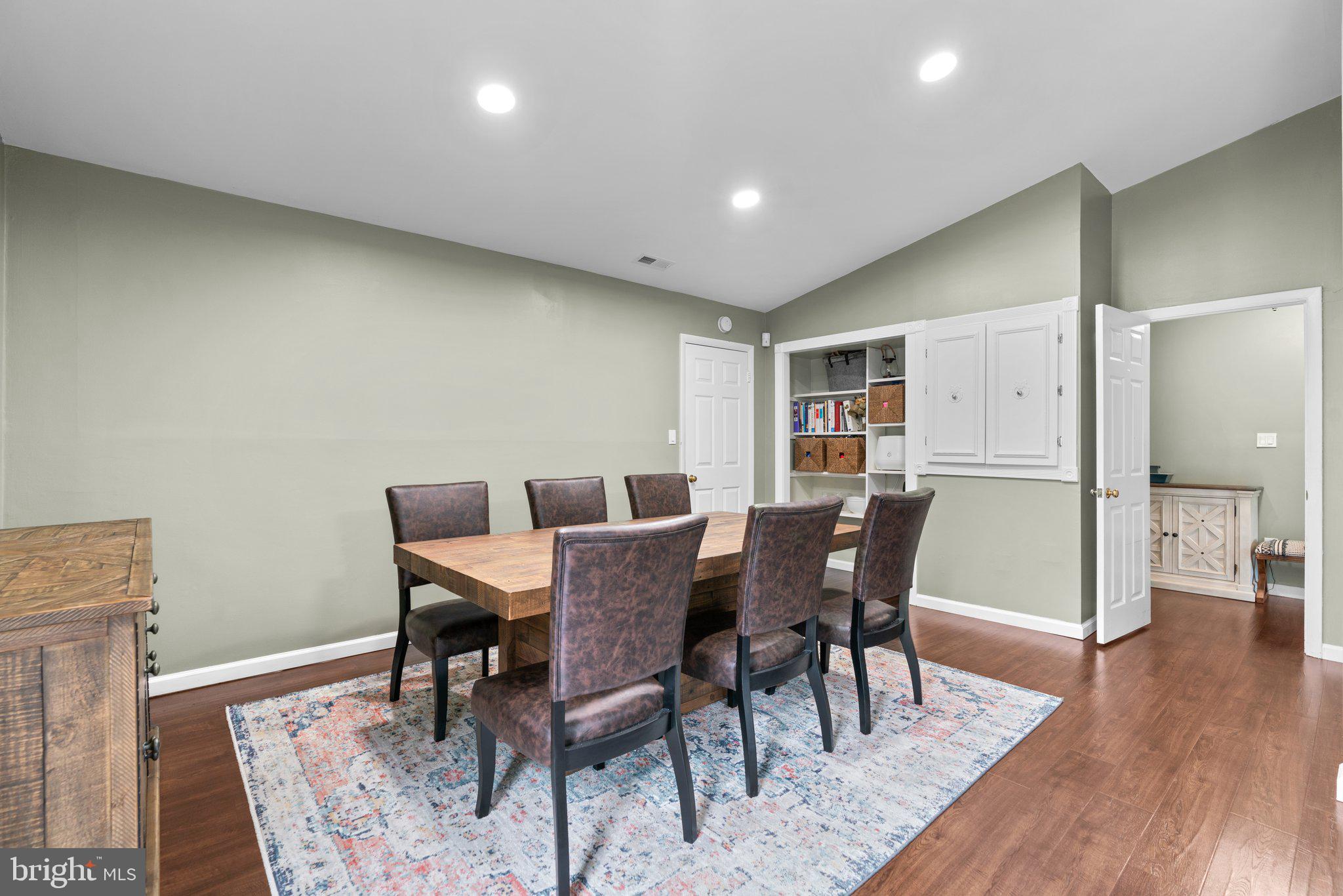 5367 Flight Feather Columbia, MD 21045 - Photo 10 of 42 a view of a dining room with furniture and wooden floor
