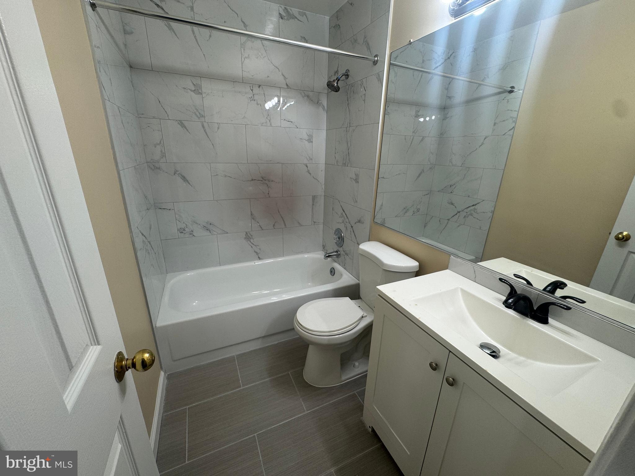 11263 Raging Brook Drive, Unit 253 Bowie, MD 20720 - Photo 3 of 22 a bathroom with a sink a toilet and shower